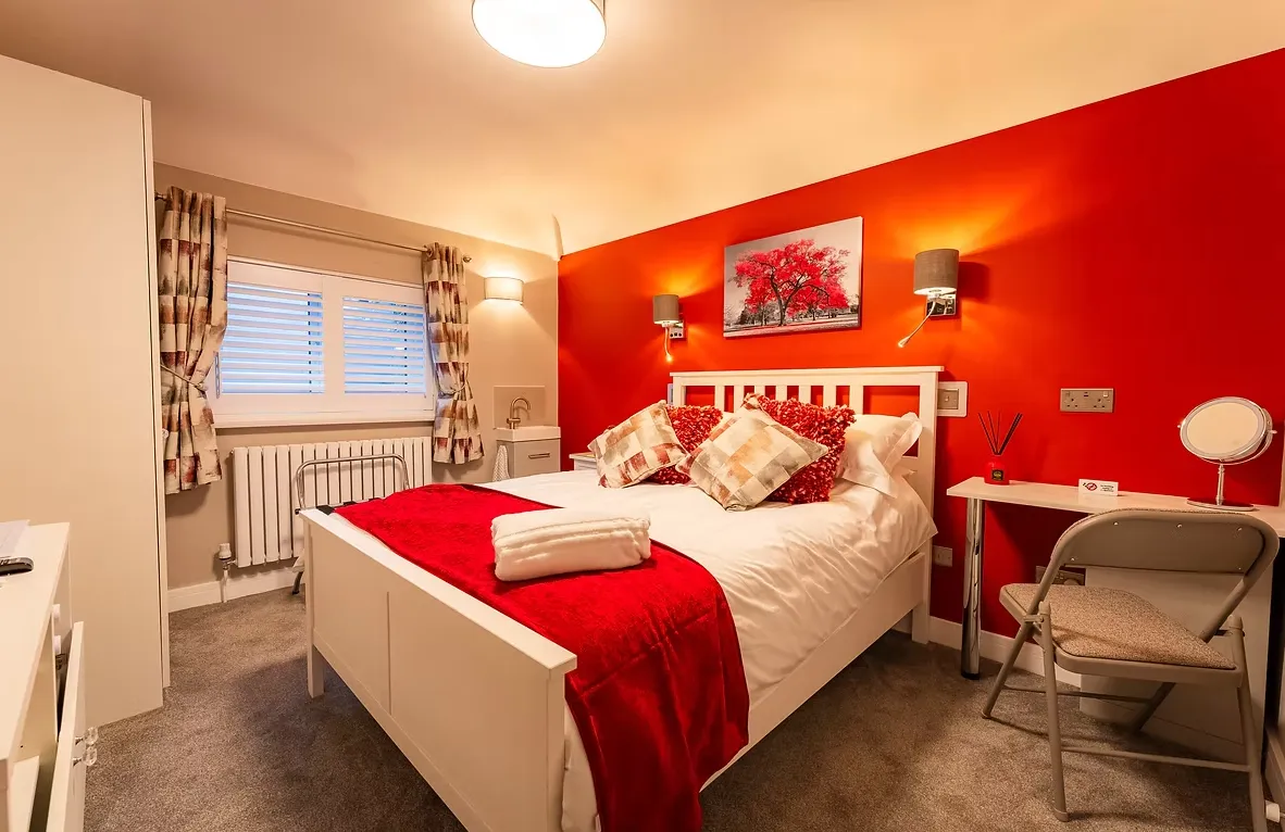 Warm, elegant double bedroom with soft lighting and contemporary decor
